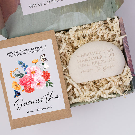 photo of a gift box containing a butterfly seed packet and a memorial garden stone